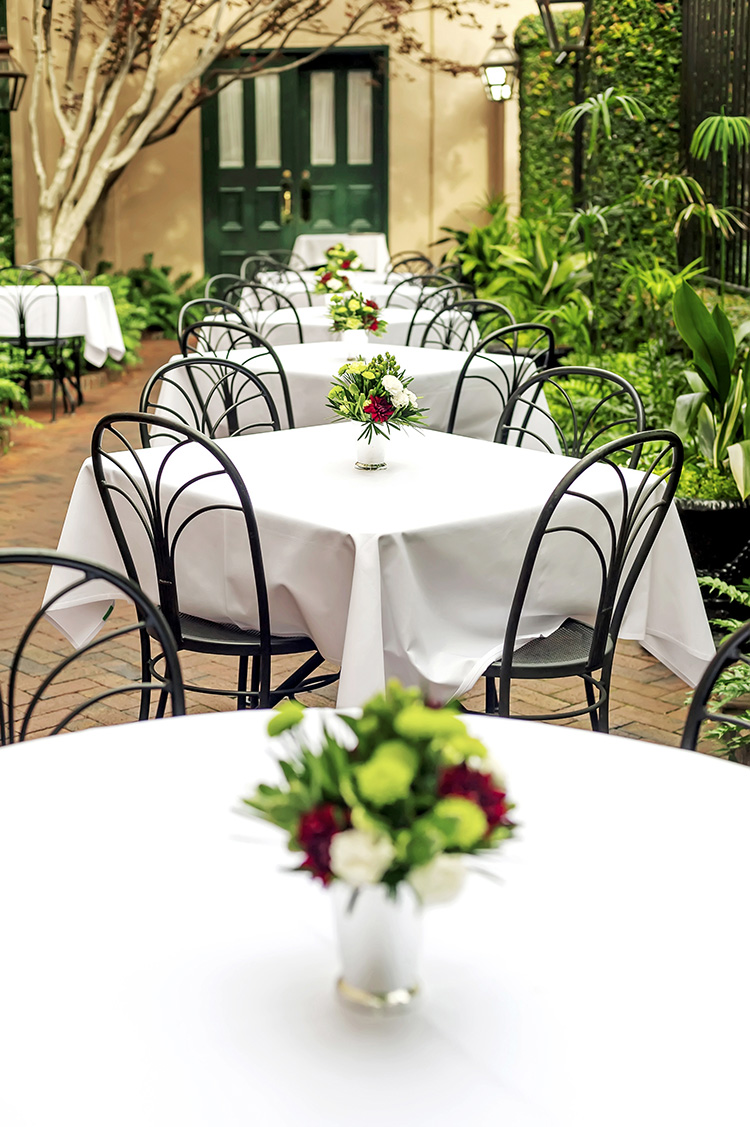 Charleston Hotel that serves breakfast in a courtyard Planters Inn courtyard tables