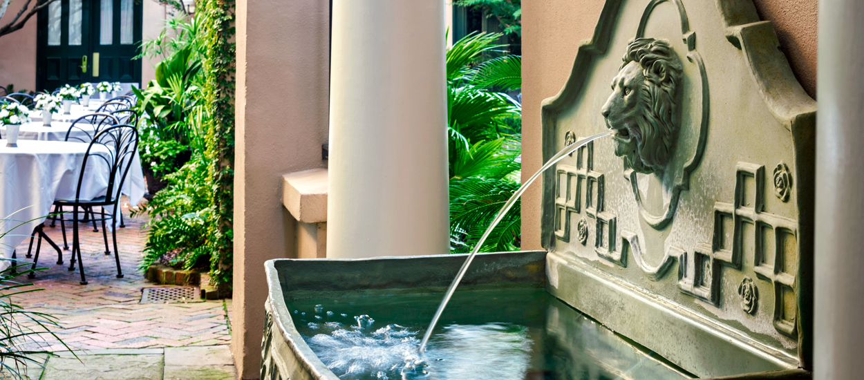 Beautiful outdoor dining area at our historic Charleston hotel