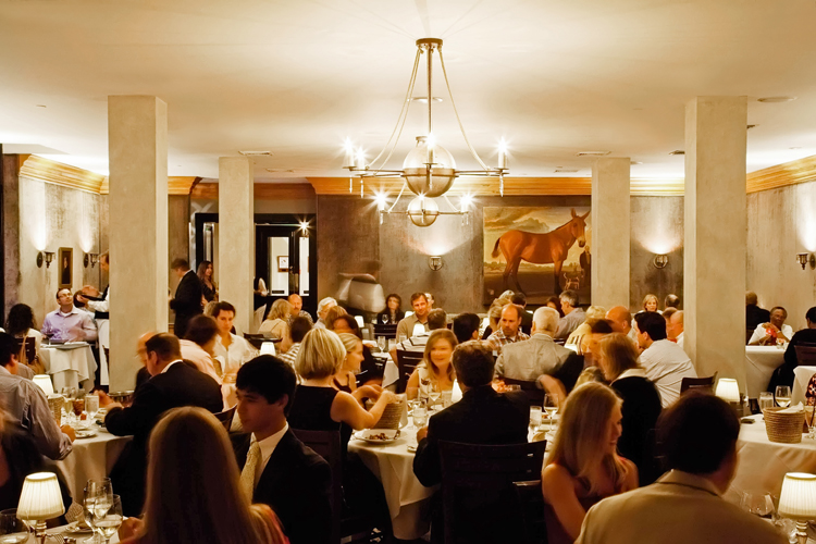 The Peninsula Grill dining room The famous velvet walls at Peninsula Grill, the four star fine dining restaurant in Charleston SC.