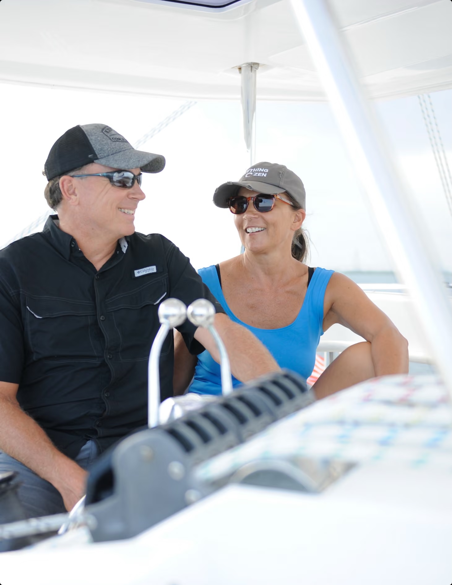 a man and woman sitting on a boat