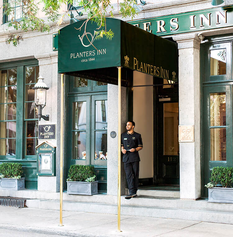 Charleston hotels downtown - Planters Inn The valet waits to park a guest